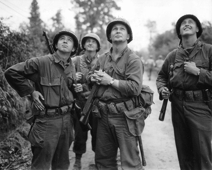 US soldiers observing an allied bombardment - note the wristwatches 