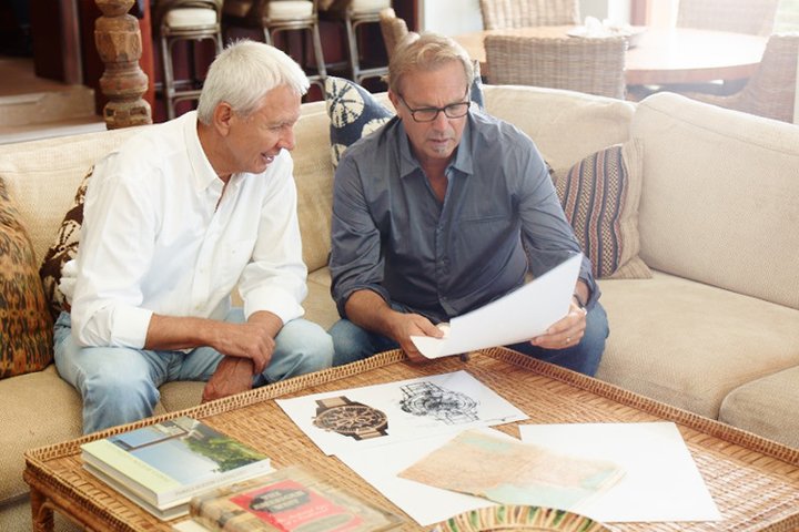 Jacques Lemans founder and CEO Alfred Riedl during a watch model review with Kevin Costner