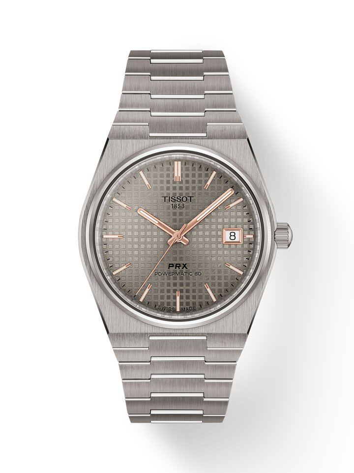 The new Tissot PRX Powermatic 80 is a tribute to enduring style, technical mastery and the subtle poetry of fine materials. Titanium captivates with its feather-light strength and commanding presence, while Damascus steel enchants with unique patterns that seem to capture the flow of time itself.